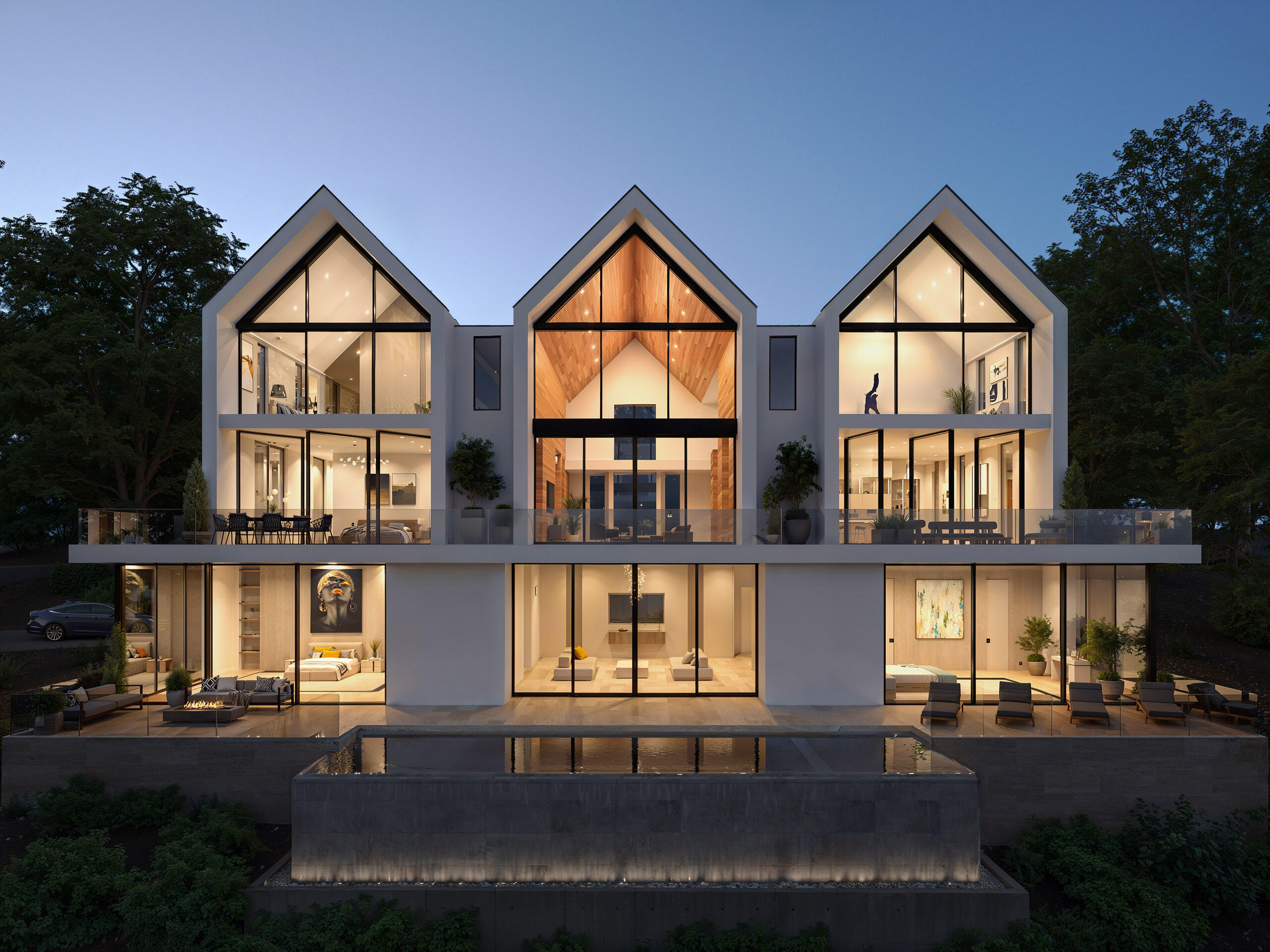 Contemporary house with three steep gabled roofs and panoramic windows