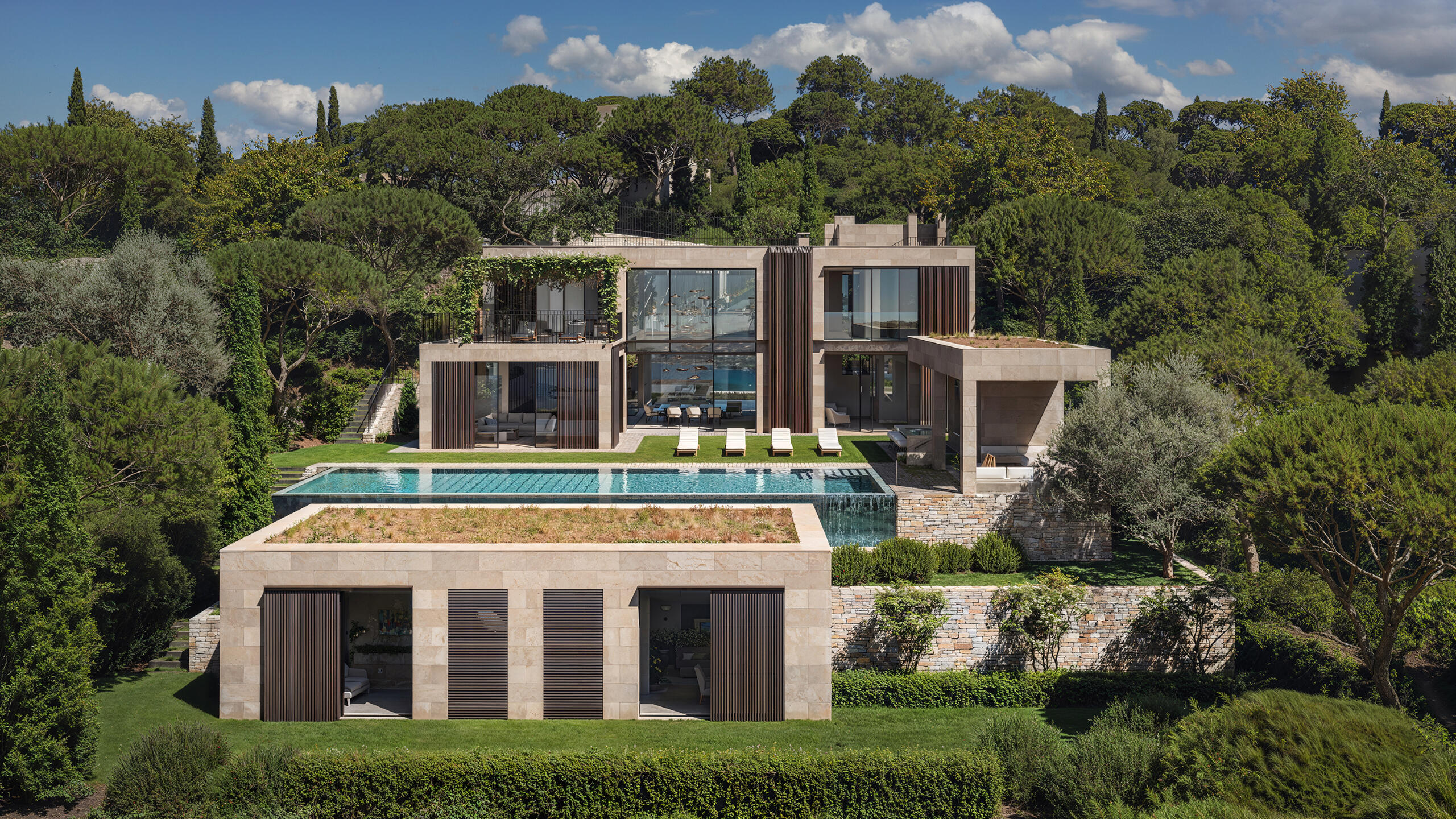Luxury villa with infinity pool on forested hillside – 3D architectural render. Saint Tropez